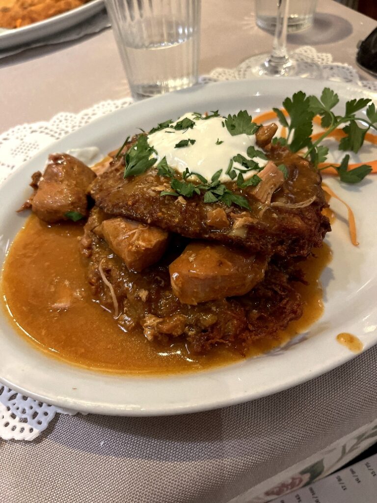 Stewed meat and potaot pancakes in Krakow Poland